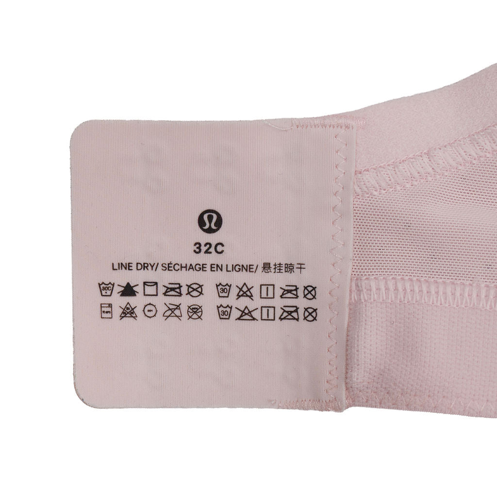 lululemon Run Times Bra black size 32C - label and interior detail view